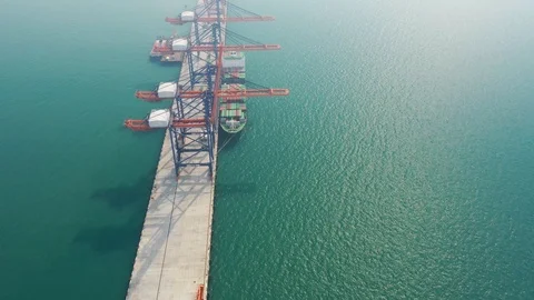 Aerial view. top view container ship in pier with crane bridge carries out expor Stockbeeldmateriaal 100545429