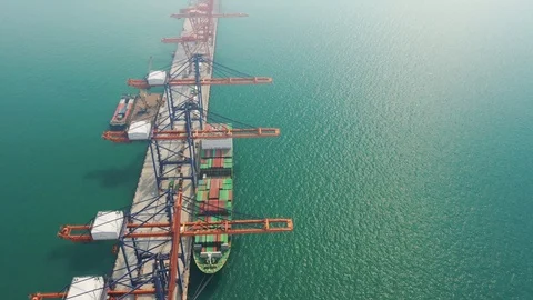 Aerial view. top view container ship in pier with crane bridge carries out expor Видео 100545991