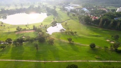 Aerial view top view golf park lake view mountain golf course in the valley Stock Footage 146728022