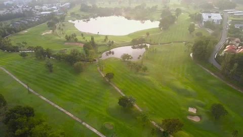 Aerial view top view golf park road mixed forest lake view green background Stock Footage 153380267