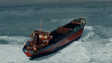 Aerial view, top view of old rusty stranded logistics ship on the beach Video stock 296483596