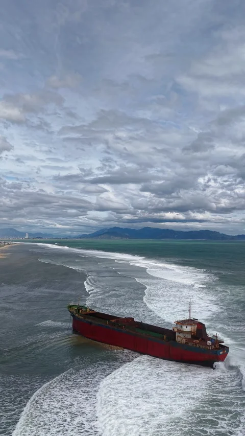 Aerial view, top view of old rusty stranded logistics ship on the beach Stock Footage 296483654