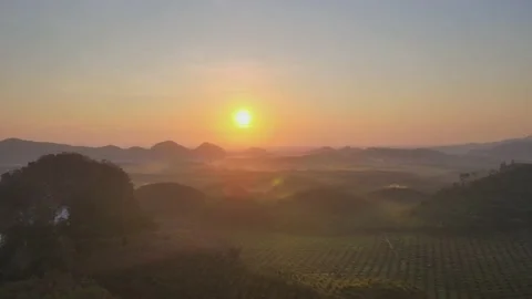 Aerial view top view sunset mountain mixed forest rubber colors cloud background Stock Footage 151064485