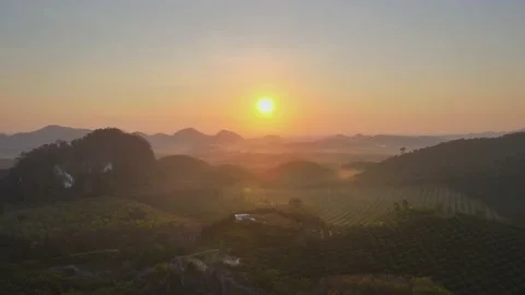 Aerial view top view sunset mountain mixed forest rubber colors cloud background Stock Footage 151064659