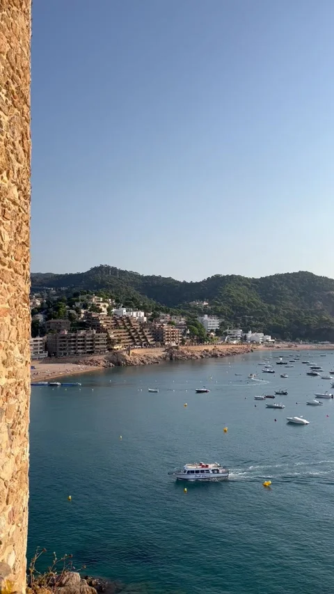 Aerial View of Tossa de Mar Bay with Tourist Boat and Yachts, Costa Brava, Spain Stock Footage 320948384