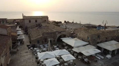 Aerial view tour of the main square of famous touristic village Stock Footage 159507433