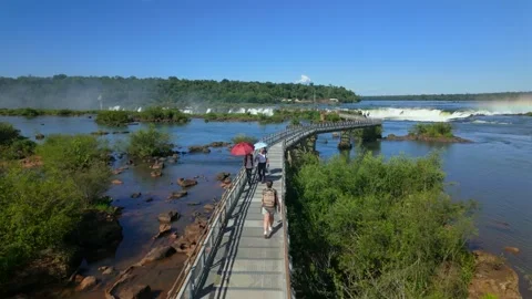 Aerial view of tourist walking on Devil's Throat Circuit walkway viewing Iguaçu Stock Footage 328963609