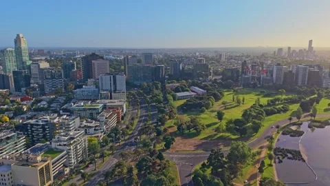 Aerial View Toward Melbourne CBD Over Parklands and City Streets Video stock 325683169