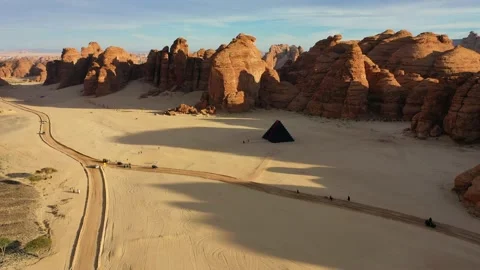 Aerial view towards the “A Concise Passage” pyramid by Rashid Alshashai at Stock Footage 217353562