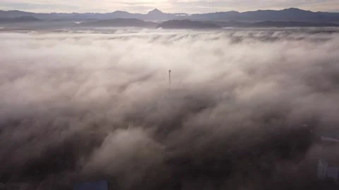 Aerial View  tower above the clouds and sunrise view in the morning Stock Footage 171193598