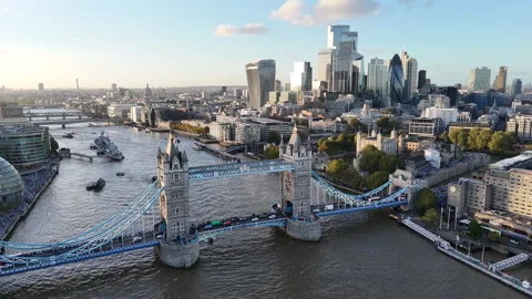 Aerial view of Tower Bridge and London skyline along the River Thames Stock Footage 346092981