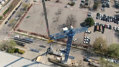 Aerial View of Tower Crane Assembly and Construction Crew in Downtown Raleigh Stock Footage 331360957