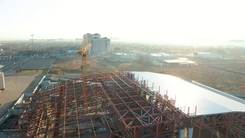 Aerial view of a tower crane working on an industrial construction site Stock Footage 121658285
