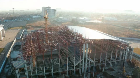 Aerial view of a tower crane working on an industrial construction site Stock Footage 121658413