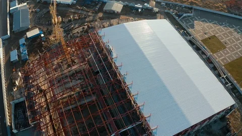 Aerial view of a tower crane working on an industrial construction site Stock Footage 121658415