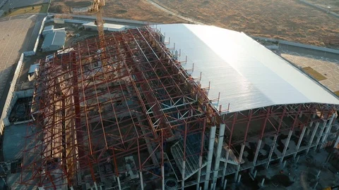 Aerial view of a tower crane working on an industrial construction site Stock Footage 121658577