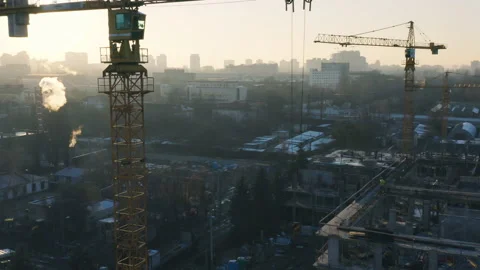 Aerial view of a tower crane working on the construction of a apartment building Stock Footage 166462124