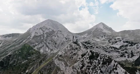 Aerial view of towering mountain range Stock Footage 303301629