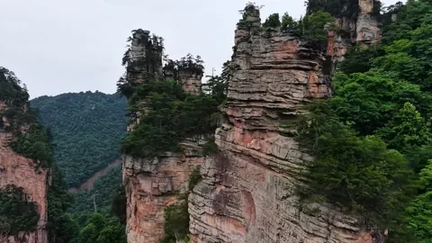 Aerial View of Towering Sandstone Pillars and Lush Forest Zhangjiajie China Stock Footage 345731129