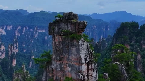 Aerial View of Towering Sandstone Pillars and Lush Forest Landscape Zhangjiajie Stock Footage 345731214
