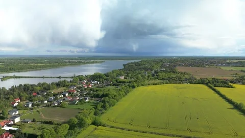 Aerial View of Town and Fields by River Stock Footage 317836023