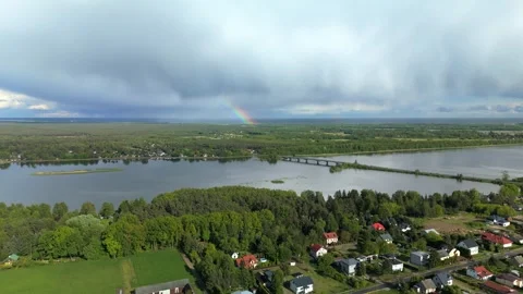 Aerial View of Town and Fields by River Stock Footage 317836315