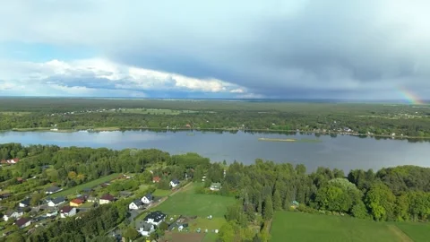 Aerial View of Town and Fields by River Stock Footage 317836317