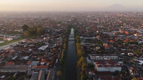 Aerial View of Town and River Canal at Sunrise, Bali Video stock 337607462