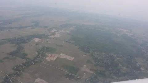 Aerial view of town and river from helicopter ride from Assam Vídeos de archivo 346138801