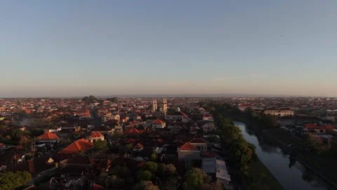 Aerial View of Town with Mosque and River at Sunrise, Bali Video stock 337607488