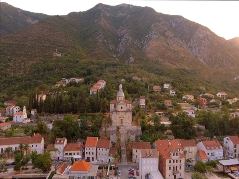 Aerial view of town with mountain on the background. Video stock 79983256