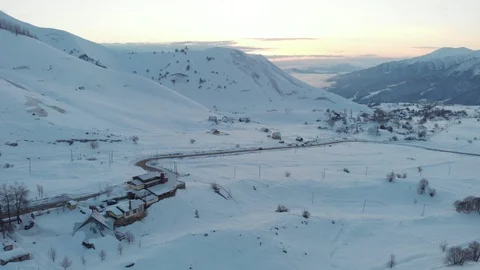 Aerial view of town in mountains at winter Stock Footage 103519448