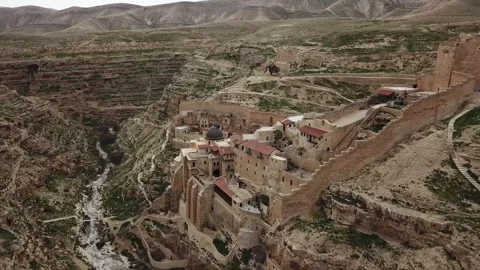 Aerial View of a Town nested in a Valley in Judea Desert Stock Footage 303826297