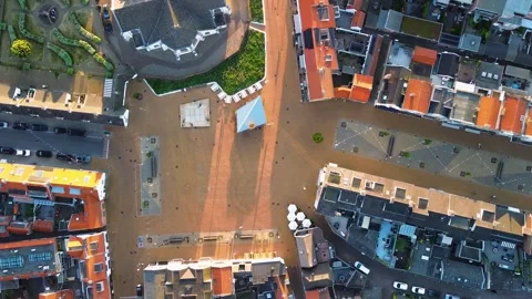 Aerial view of a town square with a large building, landscaped garden, pavilion Stock Footage 317017407