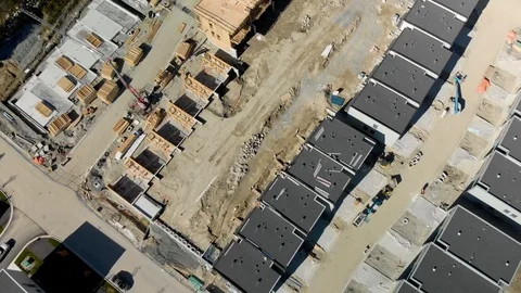 An aerial view of a townhouse complex and a new development under construction Stock-Footage 98379696