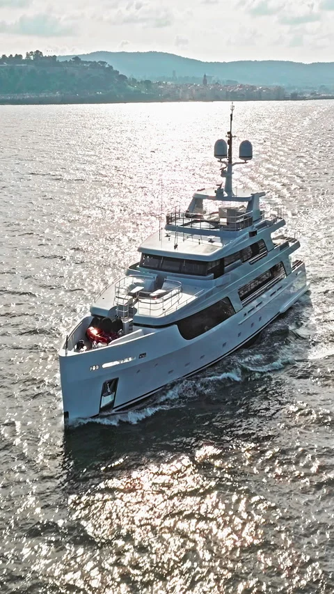 Aerial view tracking of beautiful modern white superyacht. Lifestyle luxury Stock Footage 320876148