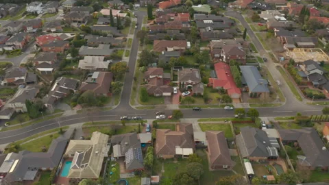 Aerial view tracking black SUV driving toward suburban destination. Stock Footage 161020054