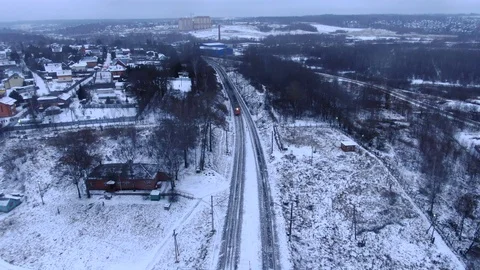 Aerial view tracking from a drone behind a railway train moving on a bridge Video stock 122430647
