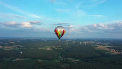Aerial view tracking shot of a hot air balloon above a beautiful german vilige Stock Footage 279814205