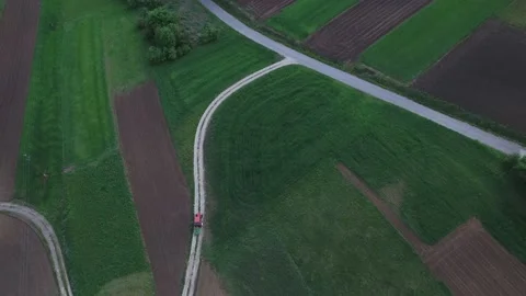 Aerial View Of Tractor Drivinig On The Path In Fields In 4K Stock Footage 141798279