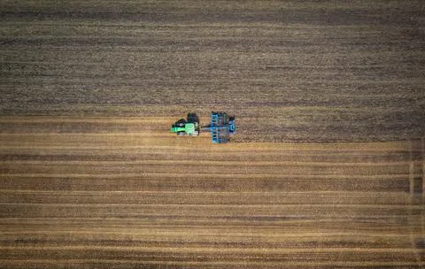 Aerial view of the tractor in the field, agricultural field work!, drone Stock Photos