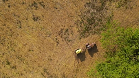 Aerial view of a tractor in a field Stock Footage 244204023