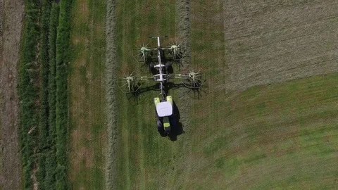 Aerial view of a tractor on the field at the haymaking - germany Stock Footage 75863867