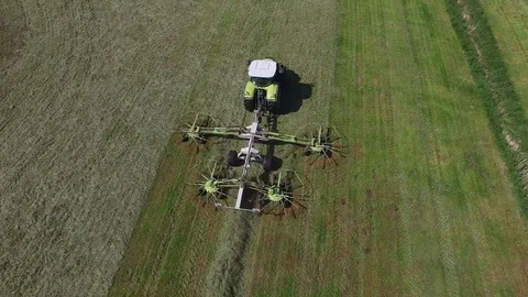 Aerial view of a tractor on the field at the haymaking - germany Stock Footage 75863895