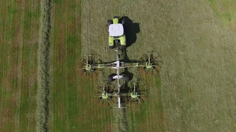 Aerial view of a tractor on the field at the haymaking - germany Stock Footage 75865536