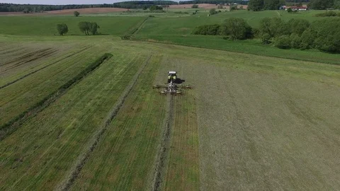Aerial view of a tractor on the field at the haymaking - germany Stock Footage 75865592