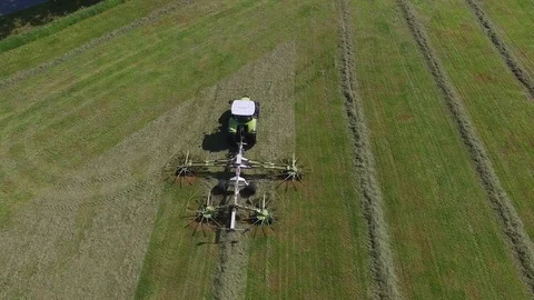 Aerial view of a tractor on the field at the haymaking - germany Stock Footage 75866087
