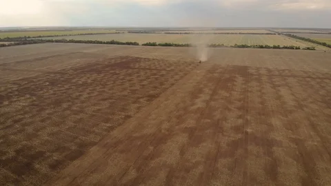 Aerial view of tractor with harrows working at field Video stock 120197522
