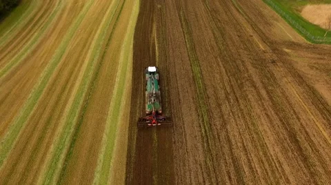 Aerial view of Tractor with Liquid Manure Spreader on field - Aerial view Stock Footage 62937888