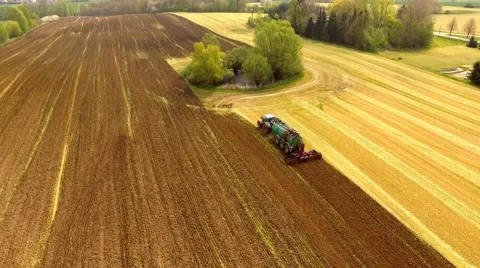 Aerial view Tractor with Liquid Manure Spreader on field - Aerial view Stock Footage 62938823